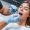 Young adult woman have a visit in the dentist clinic. Conception of stomatology.